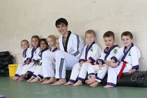 Young Coach Teaching Kids Martial Arts
